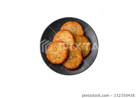 Hash browns, fried potato and onion pancakes with spices for breakfast. Fried hash browns 132350438