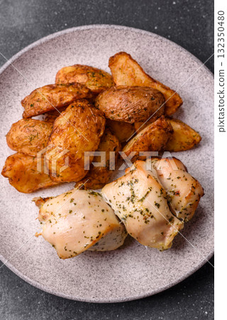 Potato wedges baked with spices, garlic and rosemary. Potato wedges Potato wedges baked with spices, garlic and rosemary. Potato wedges 132350480