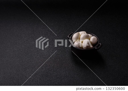 Mozzarella cheese balls, fresh white mini slices for Mediterranean food. Mozzarella cheese 132350600