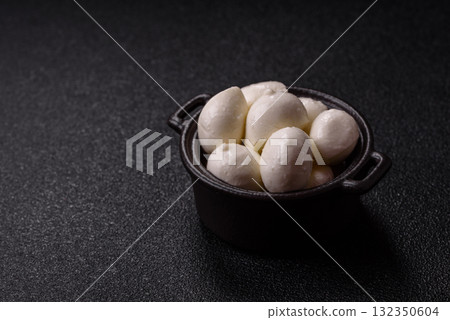 Mozzarella cheese balls, fresh white mini slices for Mediterranean food. Mozzarella cheese 132350604