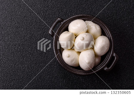 Mozzarella cheese balls, fresh white mini slices for Mediterranean food. Mozzarella cheese Mozzarella cheese balls, fresh white mini slices for Mediterranean food. Mozzarella cheese 132350605