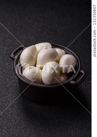 Mozzarella cheese balls, fresh white mini slices for Mediterranean food. Mozzarella cheese Mozzarella cheese balls, fresh white mini slices for Mediterranean food. Mozzarella cheese 132350607