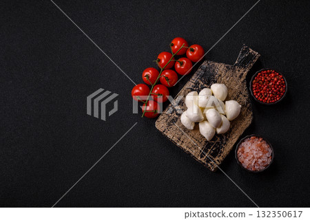 Mozzarella cheese balls, fresh white mini slices for Mediterranean food. Mozzarella cheese Mozzarella cheese balls, fresh white mini slices for Mediterranean food. Mozzarella cheese 132350617