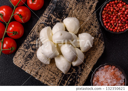 Mozzarella cheese balls, fresh white mini slices for Mediterranean food. Mozzarella cheese Mozzarella cheese balls, fresh white mini slices for Mediterranean food. Mozzarella cheese 132350621