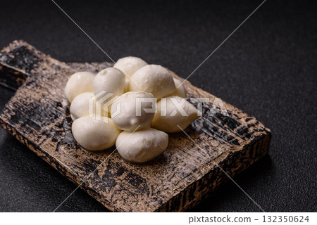Mozzarella cheese balls, fresh white mini slices for Mediterranean food. Mozzarella cheese Mozzarella cheese balls, fresh white mini slices for Mediterranean food. Mozzarella cheese 132350624