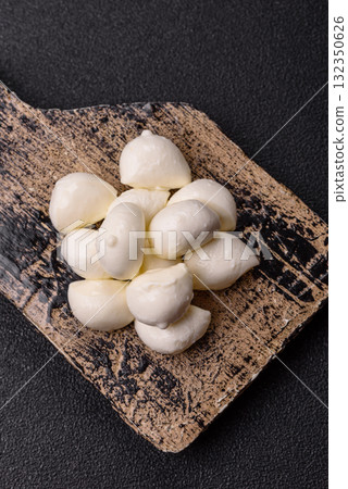 Mozzarella cheese balls, fresh white mini slices for Mediterranean food. Mozzarella cheese 132350626