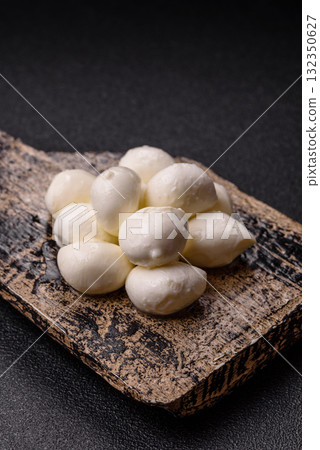 Mozzarella cheese balls, fresh white mini slices for Mediterranean food. Mozzarella cheese 132350627