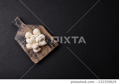 Mozzarella cheese balls, fresh white mini slices for Mediterranean food. Mozzarella cheese Mozzarella cheese balls, fresh white mini slices for Mediterranean food. Mozzarella cheese 132350629