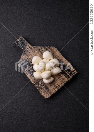 Mozzarella cheese balls, fresh white mini slices for Mediterranean food. Mozzarella cheese Mozzarella cheese balls, fresh white mini slices for Mediterranean food. Mozzarella cheese 132350630