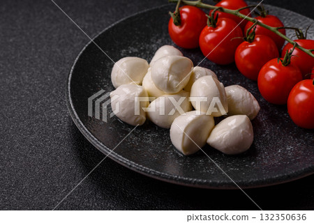 Mozzarella cheese balls, fresh white mini slices for Mediterranean food. Mozzarella cheese Mozzarella cheese balls, fresh white mini slices for Mediterranean food. Mozzarella cheese 132350636