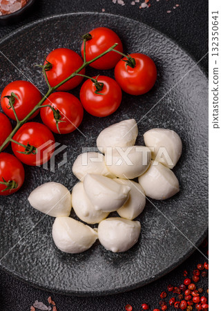 Mozzarella cheese balls, fresh white mini slices for Mediterranean food. Mozzarella cheese Mozzarella cheese balls, fresh white mini slices for Mediterranean food. Mozzarella cheese 132350641
