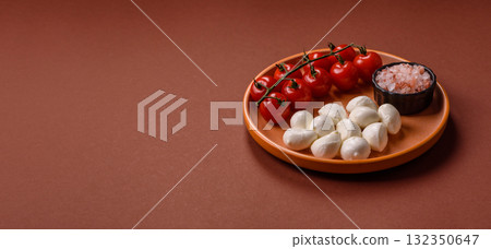 Mozzarella cheese balls, fresh white mini slices for Mediterranean food. Mozzarella cheese 132350647