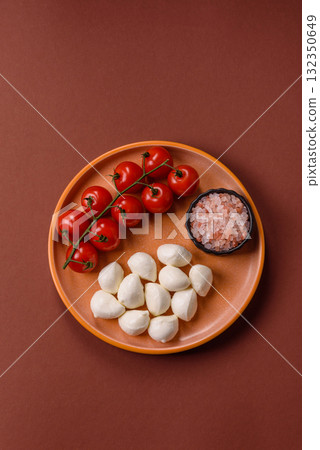 Mozzarella cheese balls, fresh white mini slices for Mediterranean food. Mozzarella cheese Mozzarella cheese balls, fresh white mini slices for Mediterranean food. Mozzarella cheese 132350649