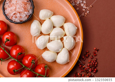 Mozzarella cheese balls, fresh white mini slices for Mediterranean food. Mozzarella cheese Mozzarella cheese balls, fresh white mini slices for Mediterranean food. Mozzarella cheese 132350655