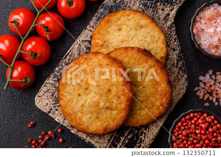Hash browns, fried potato and onion pancakes with spices for breakfast. Fried hash browns Hash browns, fried potato and onion pancakes with spices for breakfast. Fried hash browns 132350711