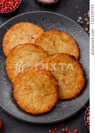 Hash browns, fried potato and onion pancakes with spices for breakfast. Fried hash browns Hash browns, fried potato and onion pancakes with spices for breakfast. Fried hash browns 132350745
