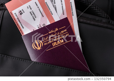 Iran passport, visa for travel, document with tickets in travel bag. Iranian passport Iran passport, visa for travel, document with tickets in travel bag. Iranian passport 132350794