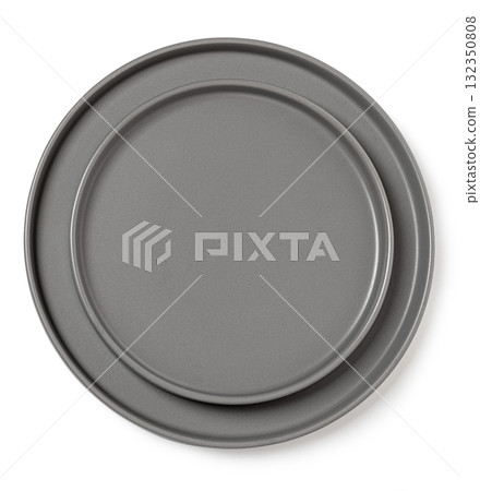Stacked gray ceramic plates on white surface Stacked gray ceramic plates on white surface 132350808