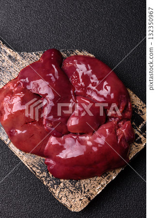 Raw fresh chicken or turkey liver, internal offal of poultry. Raw chicken liver Raw fresh chicken or turkey liver, internal offal of poultry. Raw chicken liver 132350967