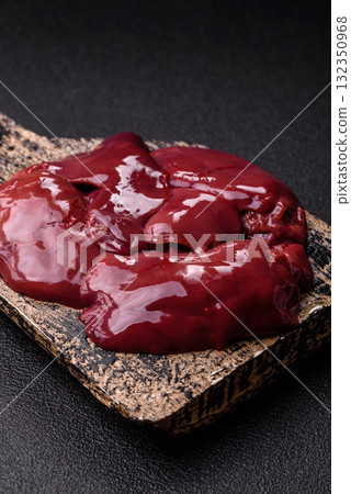 Raw fresh chicken or turkey liver, internal offal of poultry. Raw chicken liver Raw fresh chicken or turkey liver, internal offal of poultry. Raw chicken liver 132350968