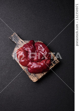 Raw fresh chicken or turkey liver, internal offal of poultry. Raw chicken liver Raw fresh chicken or turkey liver, internal offal of poultry. Raw chicken liver 132350971