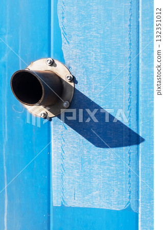 An Intricate Industrial Pipe Detail Set Against a Vibrant Blue Background An Intricate Industrial Pipe Detail Set Against a Vibrant Blue Background 132351012