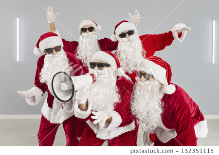 Cool Santa team with megaphone, festive office scene for business campaigns 132351115