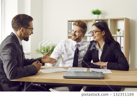 Corporate business people having a meeting in office, signing a contract and smiling. 132351189