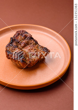 Pork breast steak, grilled fillet, healthy food, lunch. Pork steak as food background Pork breast steak, grilled fillet, healthy food, lunch. Pork steak as food background 132351363