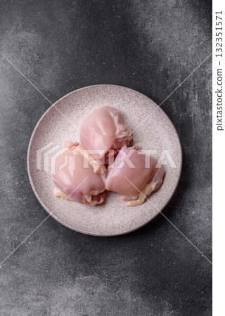 Chicken or turkey raw thigh fillet, skinless and boneless poultry meat. Chicken thigh fillet 132351571