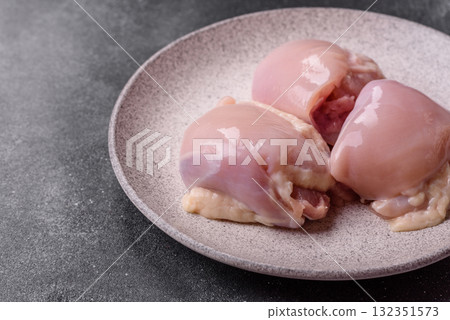 Chicken or turkey raw thigh fillet, skinless and boneless poultry meat. Chicken thigh fillet 132351573