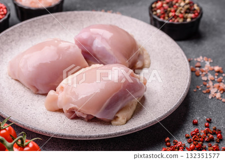 Chicken or turkey raw thigh fillet, skinless and boneless poultry meat. Chicken thigh fillet Chicken or turkey raw thigh fillet, skinless and boneless poultry meat. Chicken thigh fillet 132351577
