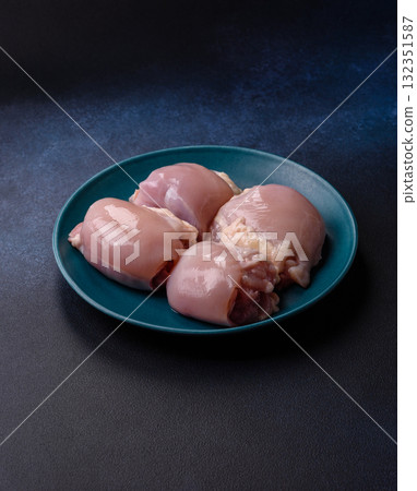 Chicken or turkey raw thigh fillet, skinless and boneless poultry meat. Chicken thigh fillet 132351587