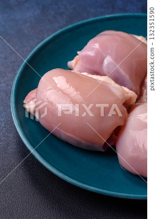 Chicken or turkey raw thigh fillet, skinless and boneless poultry meat. Chicken thigh fillet 132351590
