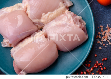 Chicken or turkey raw thigh fillet, skinless and boneless poultry meat. Chicken thigh fillet Chicken or turkey raw thigh fillet, skinless and boneless poultry meat. Chicken thigh fillet 132351592