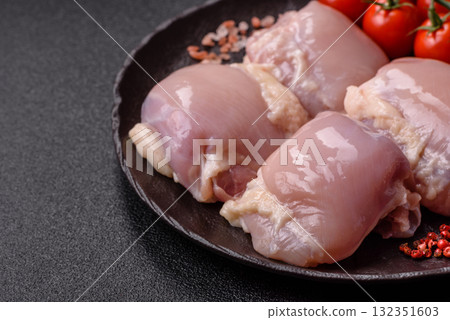 Chicken or turkey raw thigh fillet, skinless and boneless poultry meat. Chicken thigh fillet Chicken or turkey raw thigh fillet, skinless and boneless poultry meat. Chicken thigh fillet 132351603