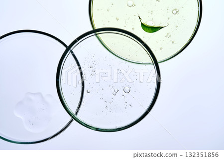 Textures of cosmetics in petri dishes. 132351856
