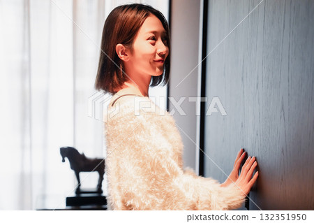 A young woman arriving at a luxury hotel and getting changed A young woman arriving at a luxury hotel and getting changed 132351950