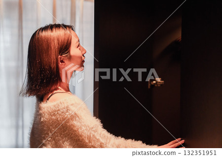 A young woman arriving at a luxury hotel and getting changed A young woman arriving at a luxury hotel and getting changed 132351951