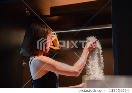 A young woman arriving at a luxury hotel and getting changed A young woman arriving at a luxury hotel and getting changed 132351954