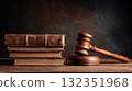 A wooden judge's gavel and a stack of law books on a wooden table, brown background. Concept of law, equality, and justice. Law office, legal and forensic 132351968