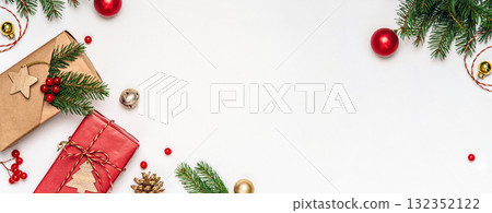 Flat lay composition with craft paper presents, eco wrapping and fir branches on white background. Copy space Christmas template for greetings and branding. 132352122