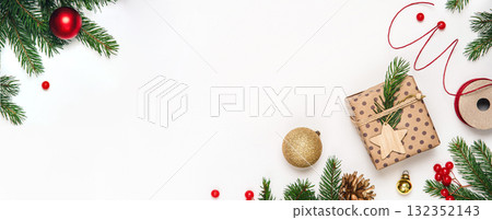 Top view of Christmas presents in craft paper with pine branches and baubles on white background. Minimal festive mockup with copy space. Top view of Christmas presents in craft paper with pine branches and baubles on white background. Minimal festive mockup with copy space. 132352143