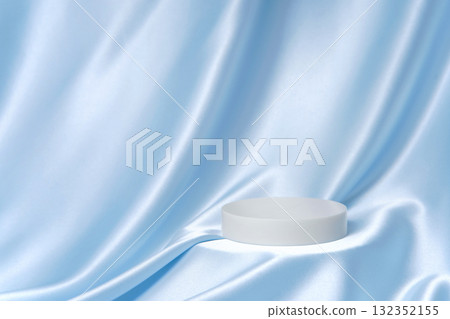 Light blue satin drape with a single round podium and generous copy space. Minimal luxury background for cosmetics, skincare and packaging ads. Light blue satin drape with a single round podium and generous copy space. Minimal luxury background for cosmetics, skincare and packaging ads. 132352155