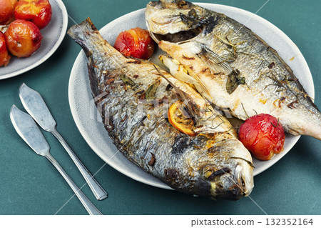 Roasted whole sea bream fish or dorado. 132352164