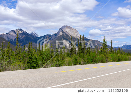 Scenic rout through mountains and forests, highway view. 132352196