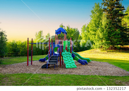 Empty colorful playground in the summer park in hot day. Empty colorful playground in the summer park in hot day. 132352217
