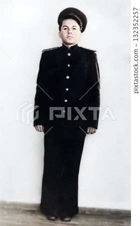 An old portrait of a handsome young man in a typical school uniform. Bogoroditsk, USSR. Retro photograph from 1955. An old portrait of a handsome young man in a typical school uniform. Bogoroditsk, USSR. Retro photograph from 1955. 132352257