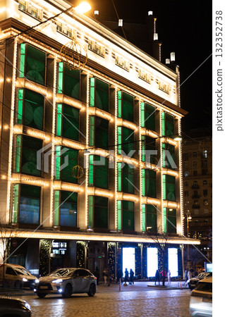 Christmas lights and garlands shining on the TSUM building facade in Kyiv Christmas lights and garlands shining on the TSUM building facade in Kyiv 132352738