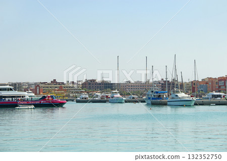 View of embankment of Hurghada with moored yachts, ships and beautiful mosque View of embankment of Hurghada with moored yachts, ships and beautiful mosque 132352750
